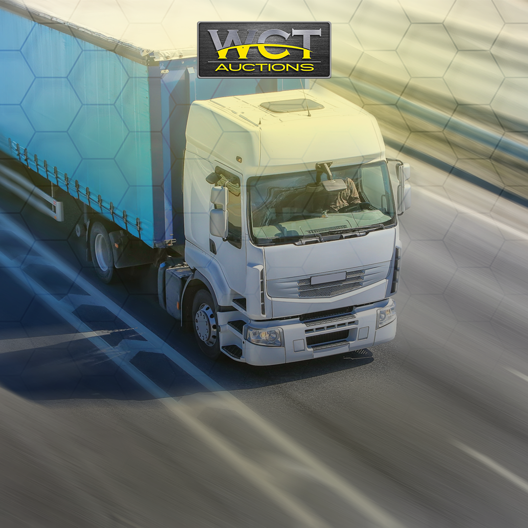WCT Auctions truck and trailer on highway for trailer auction sale