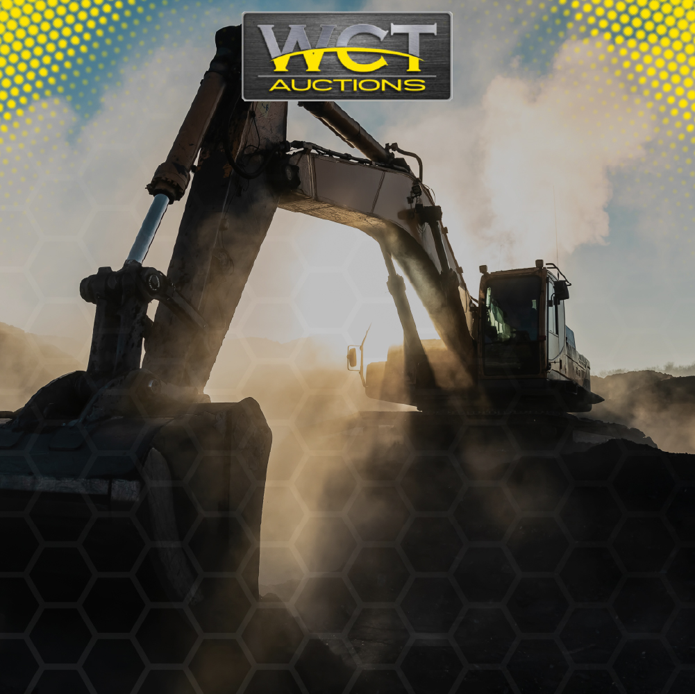 Excavator operating on a dusty construction site during sunset – WCT Auctions