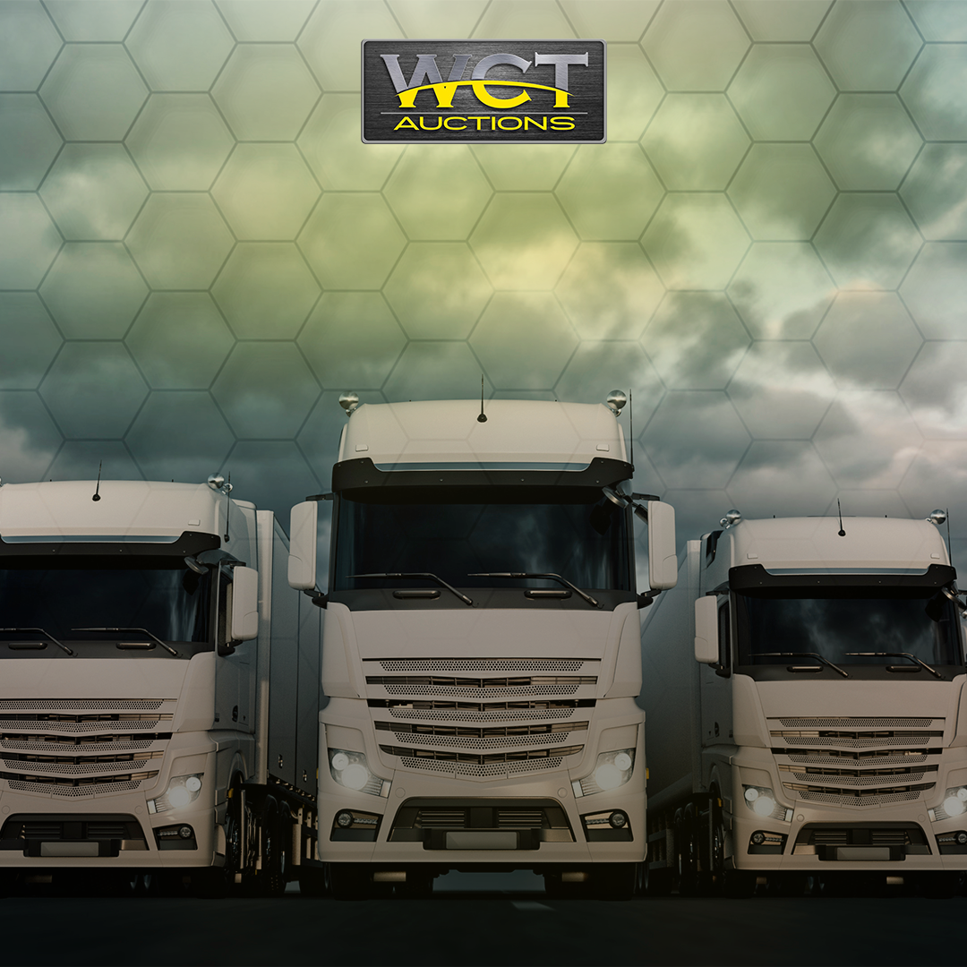 Three commercial trucks beneath the WCT Auctions logo for truck auctions in South Africa